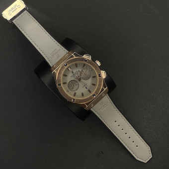 هابلوت مردانه کد(7265)بند طوسی قاب مسی صفحه طوسی