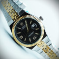 رولکس oyster perpetual مردانه کد (644) بند و قاب نقره ای طلایی صفحه مشکی