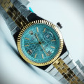 رولکس oyster perpetual مردانه کد (645) بند و قاب نقره ای طلایی صفحه آبی روشن