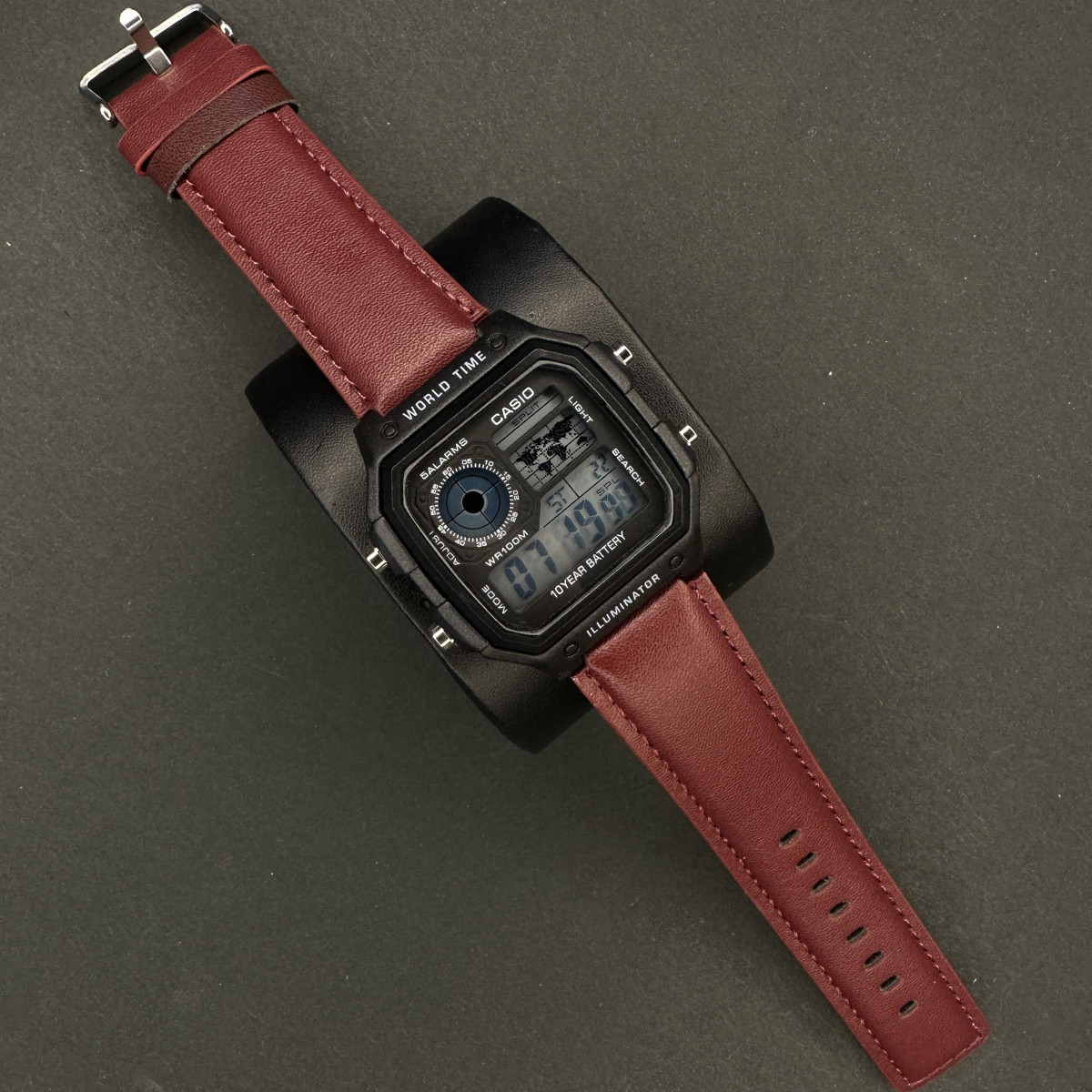 کاسیو جهان نما بند چرمی مردانه کد (6587) قاب مشکی بند زرشکی